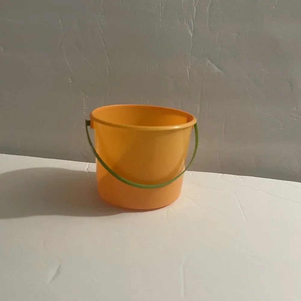 Small Orange Pail with Green Handle